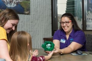 girl getting new piggy bank